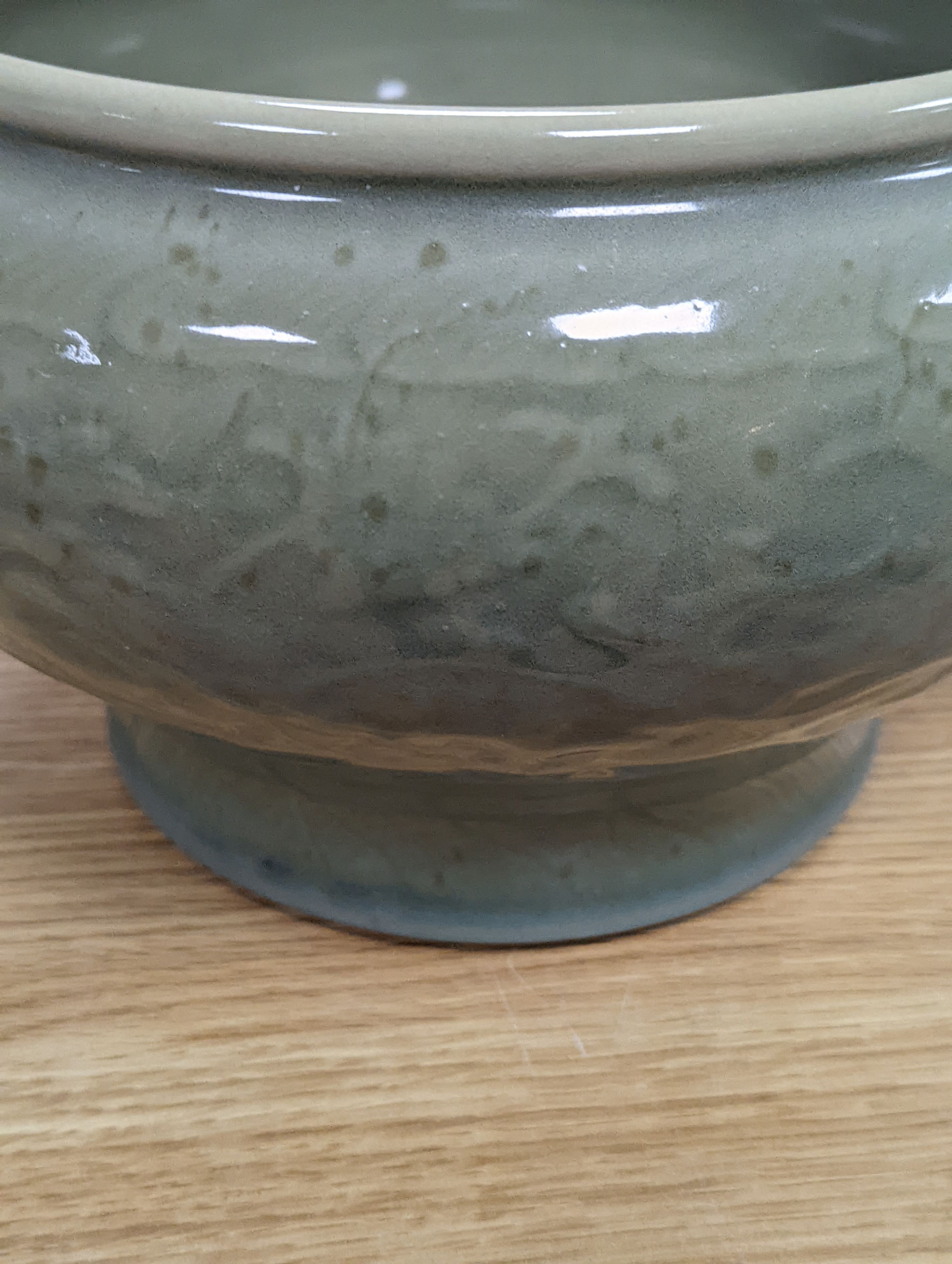 A Chinese celadon glazed bowl - 17.5cm tall